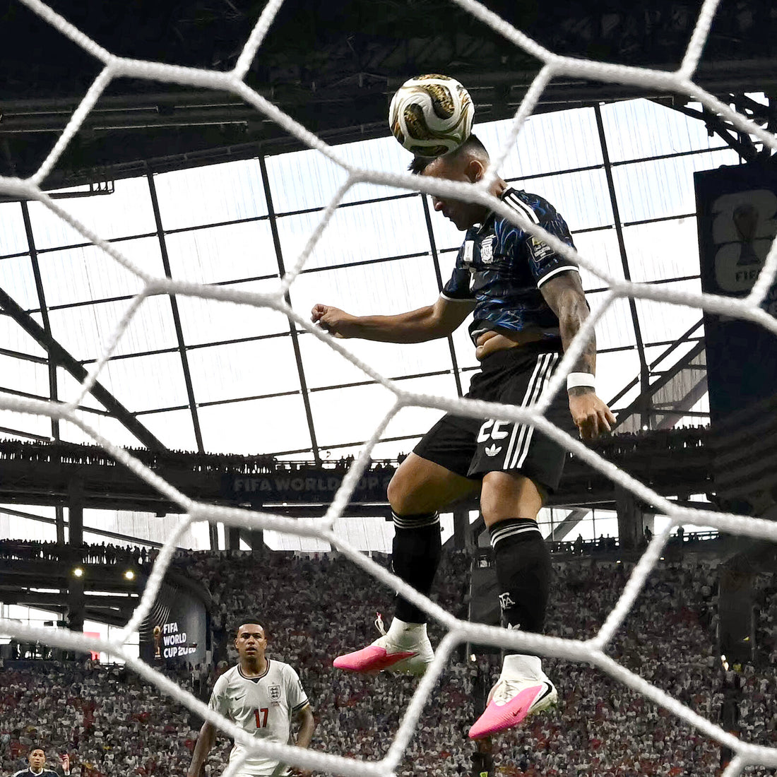 A soccer player scoring a goal