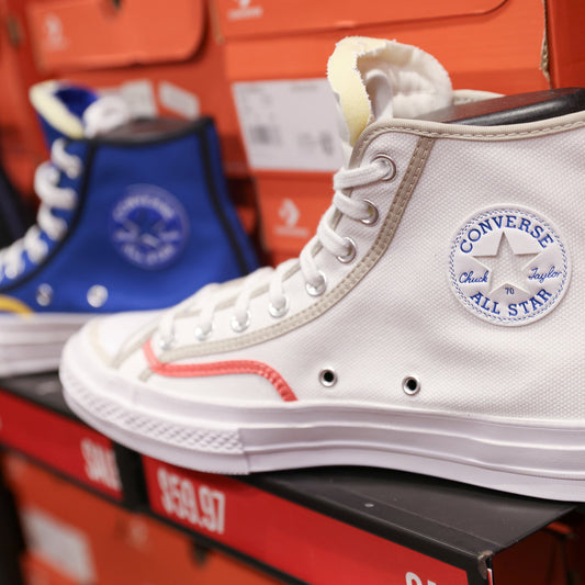 Screenshot of the controversial Converse ad showing a hooded figure beside a noose, prompting accusations of KKK imagery.