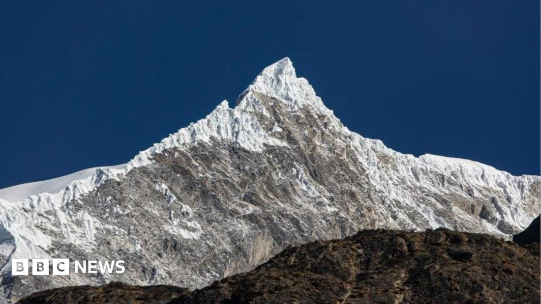 Aerial view of a Himalayan glacier showing crevasses and meltwater streams