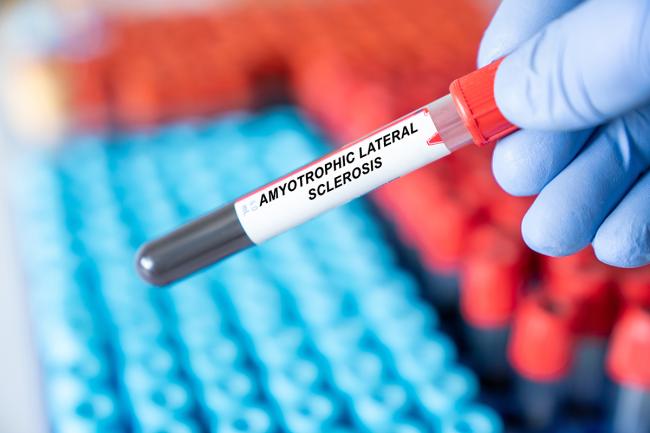 A scientist holding a blood sample