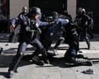 Paris protest with tear‑gas canisters released into a crowd of demonstrators