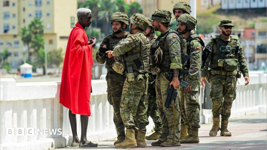Migrants attempting to cross the border in Ceuta