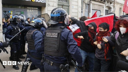 Students confronting riot police outside a French high school during the 2024 education protests
