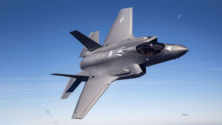 F-35 pilot wearing Gen III helmet with visor displaying infrared video feed