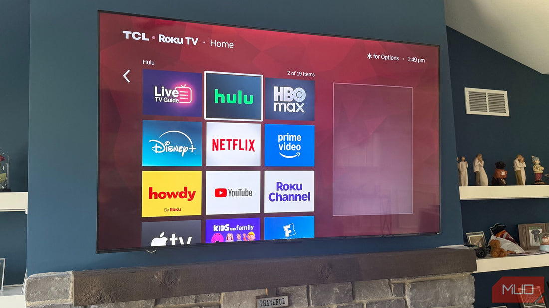 Close-up view of a smart TV front panel highlighting the tiny built‑in camera lens.