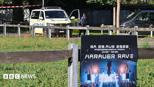 Police cordon and emergency vehicles at the Zurich rave venue after the shooting