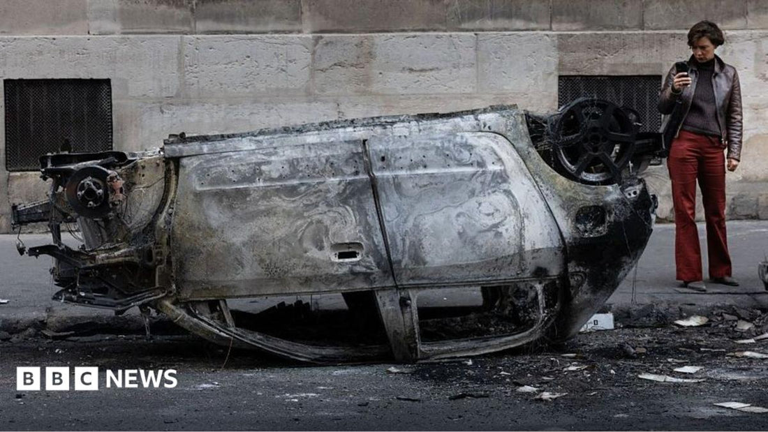 Night‑time view of French city streets lit by police vehicle lights during the 2024 riots