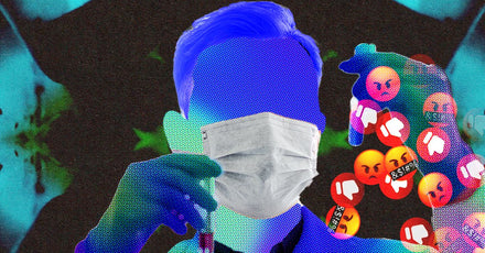 A person in a lab coat holding a beaker