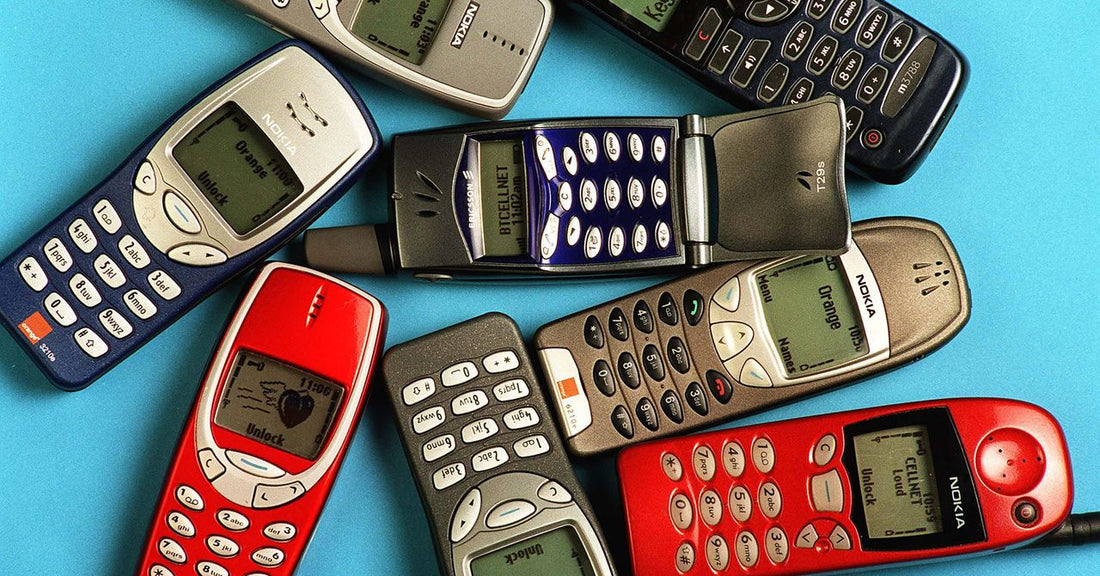 A person holding a burner phone