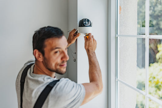 A front‑door security camera mounted at eye level, clearly visible from the street.