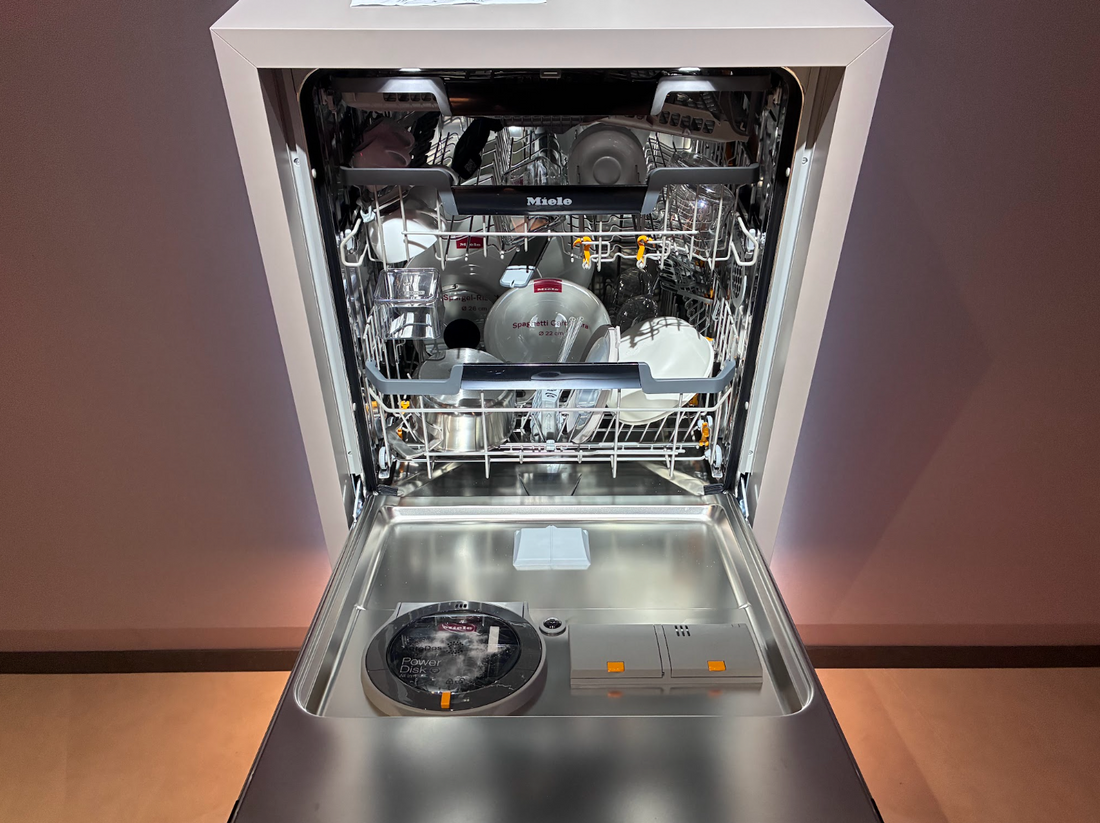 Close-up of Miele dishwasher door showing the concealed camera lens.