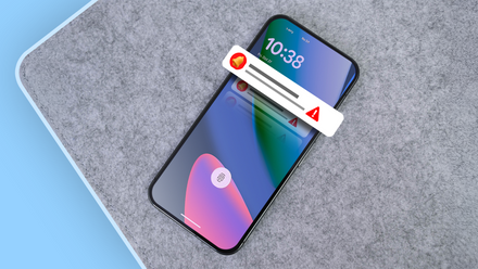 A person holding an Android phone with a flooded notification screen