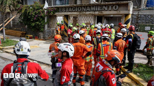 Rescue workers navigating damaged infrastructure