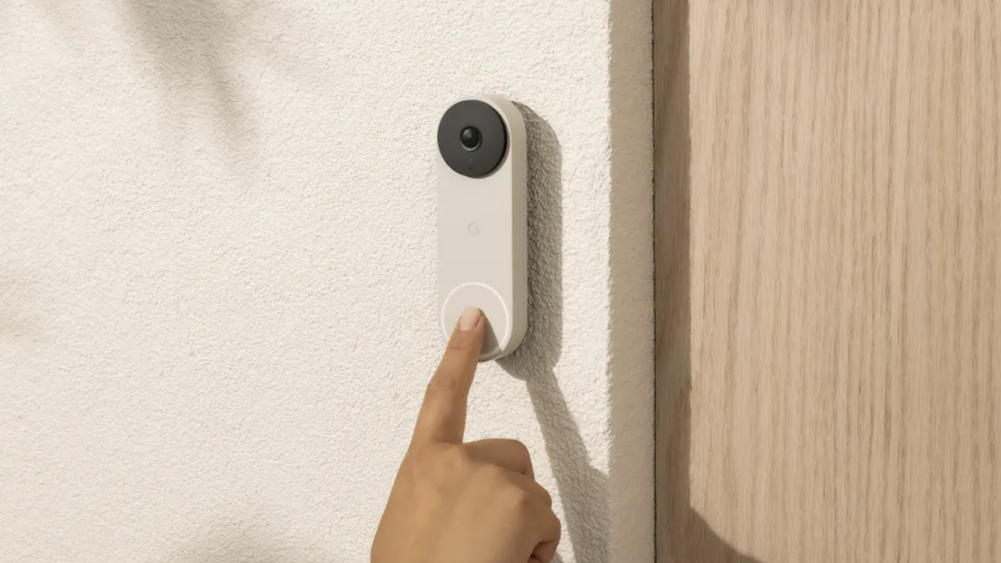 Close-up of a smart video doorbell displaying an AI‑generated greeting on a smartphone screen