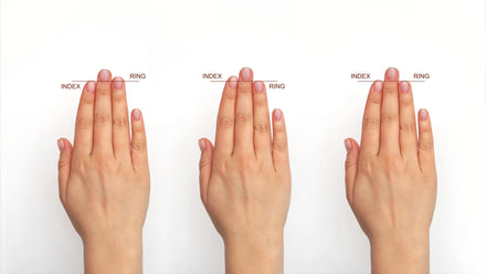 A newborn's hand with finger-length patterns