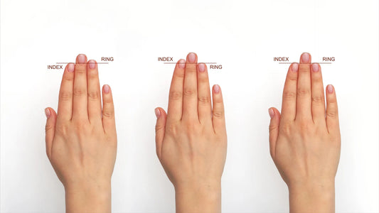 A newborn's hand with finger-length patterns