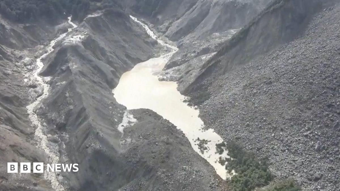 Aerial view of a high‑altitude lake formed by a landslide near the Nepal‑Tibet border