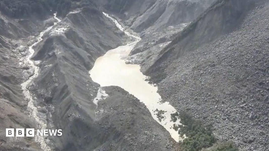 Aerial view of a high‑altitude lake formed by a landslide near the Nepal‑Tibet border
