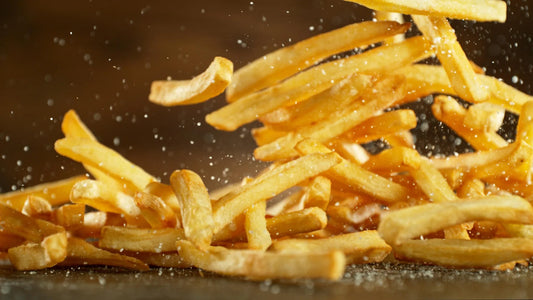 A plate of crispy French fries