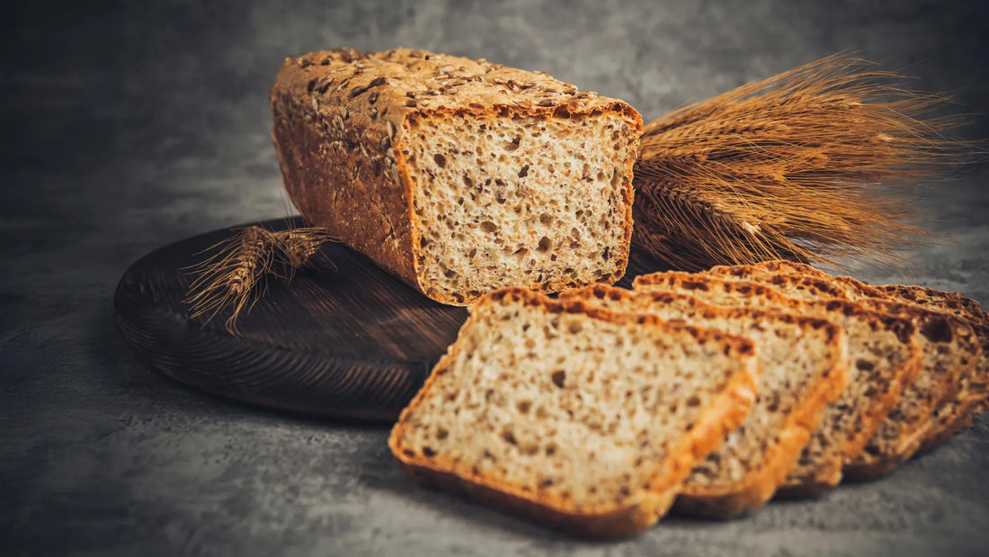 Plate showing four to six standard servings of whole grains including oatmeal, brown rice, and whole-wheat bread