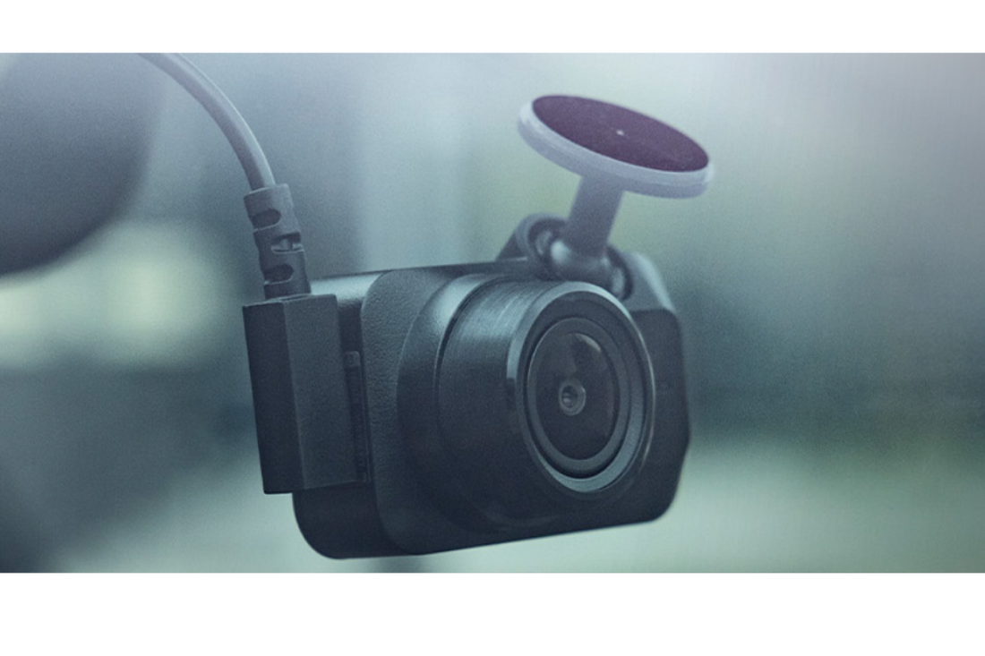 Garmin Mini 3 dash cam mounted on a car windshield showing its compact design