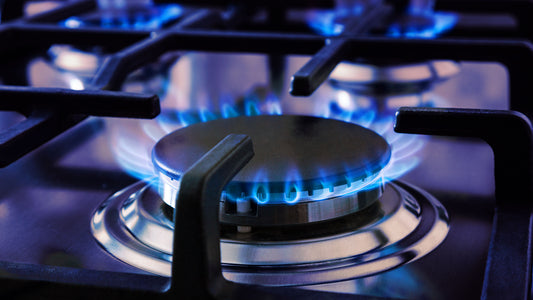 A person cooking on an electric stove