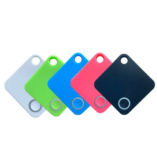 Assorted colors of compact keychain GPS trackers for real-time location tracking.
