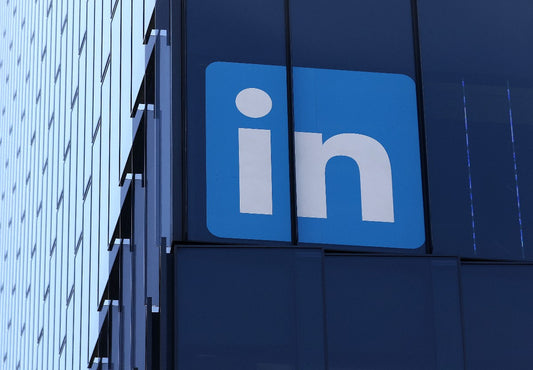Screenshot of LinkedIn profile showing a peer endorsement badge next to work experience