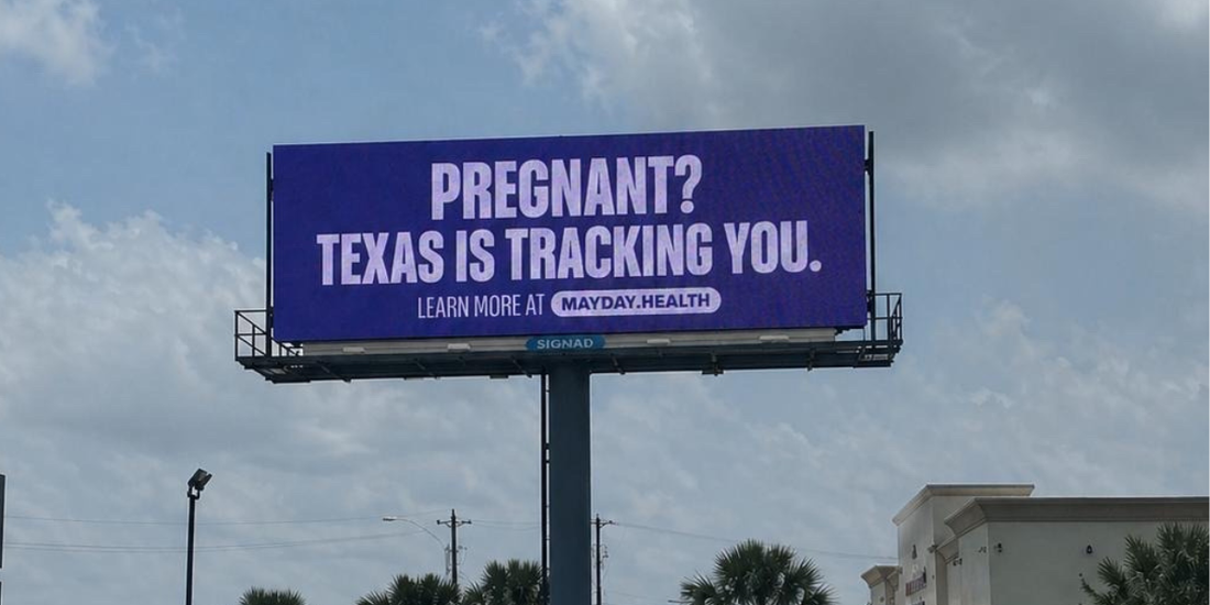 A billboard warning drivers that they could be tracked if they're pregnant