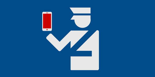 A person holding a phone at a border crossing