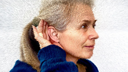 A person covering their ears