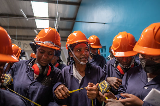 Women in construction hard hats and vests