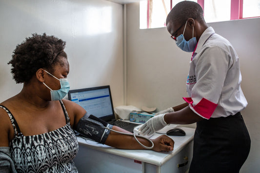 Medical worker using an AI tool in a clinic