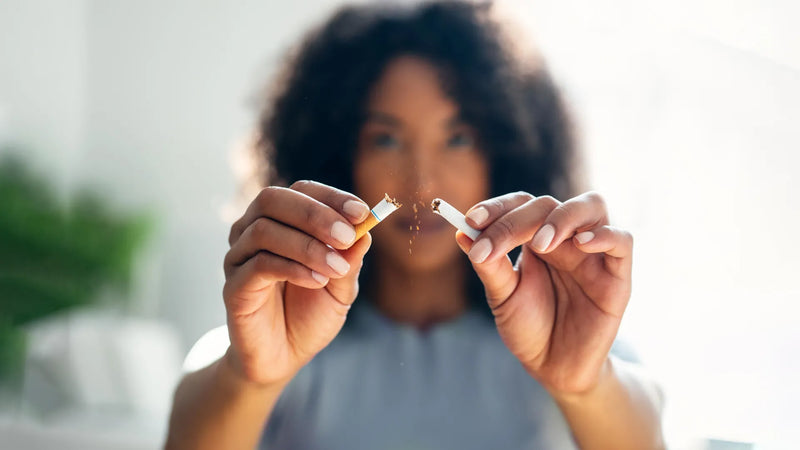 Bar chart comparing quit rates of e‑cigarettes, nicotine patches, and gum across 80 clinical trials