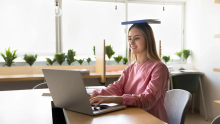 A person sitting at a desk with good posture