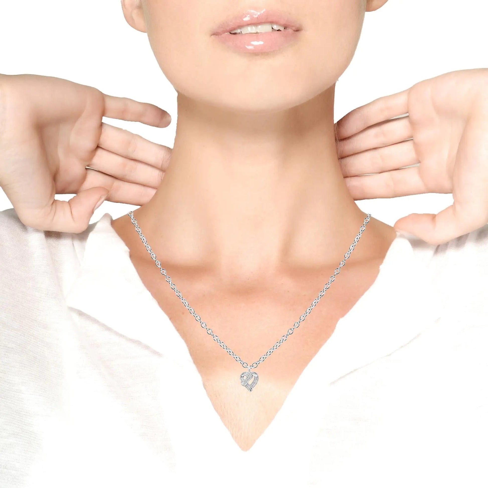 .925 Sterling Silver 1 1/4 Cttw Round Diamond Openwork Ribbon Weave Heart Pendant 18" Necklace (I-J Color, I3 Clarity) by Anti Spier